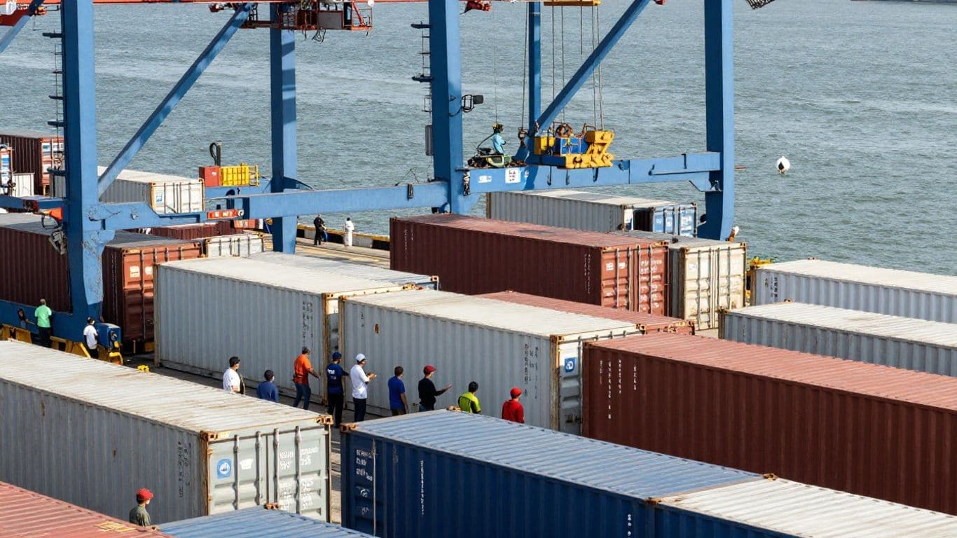 Global shipping port with containers and cargo.
